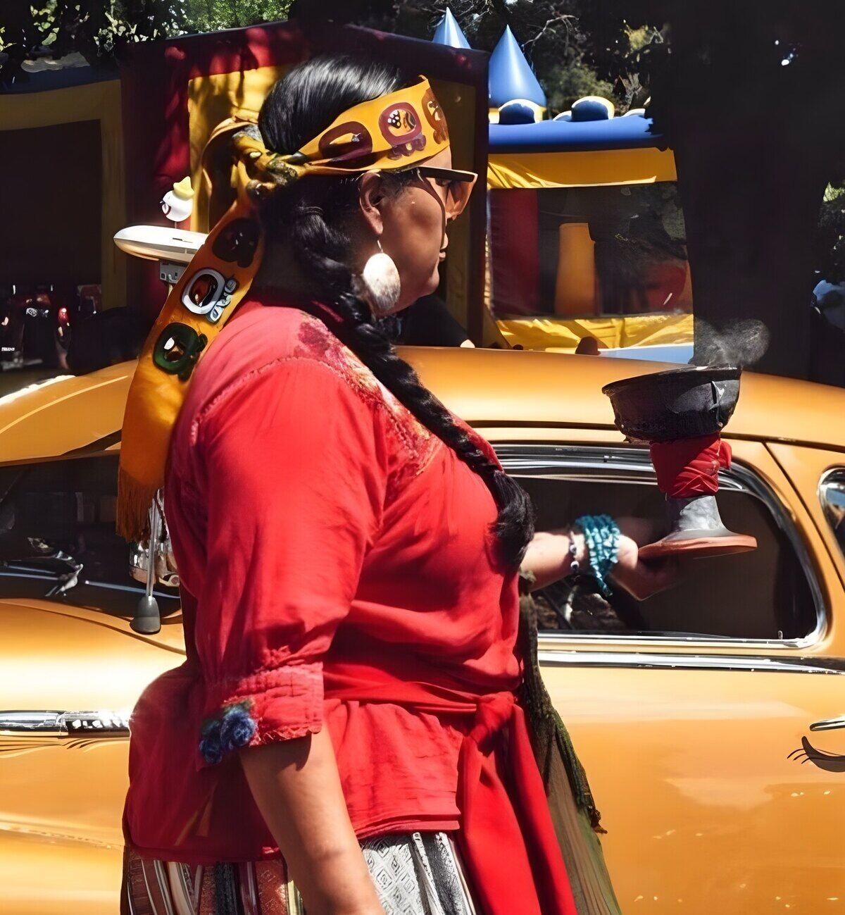 Beverly Castaneda in ceremony, holding a copal vessel